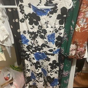 Sleeveless mid length black and blue floral dress